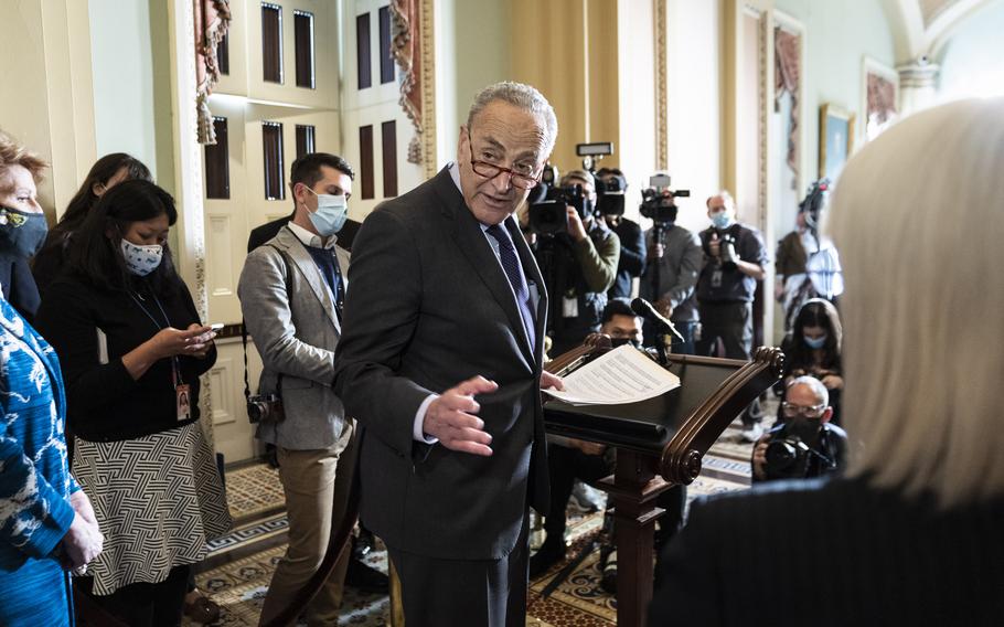 Senate Majority Leader Charles Schumer, D-N.Y., shown here at a Nov. 30, 2021, news conference on Capitol Hill, has cited "good progress" in talks with his Republican Senate counterpart. 