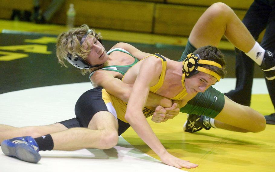 Kubasaki's McKay Chandler gets the upper hand on Kadena's Nicholas Jeanblanc at 129 pounds during Wednesday's Okinawa wrestling dual meet. McKay pinned Jeanblanc in 2 minutes, 19 seconds, but the Panthers won the meet 30-28.