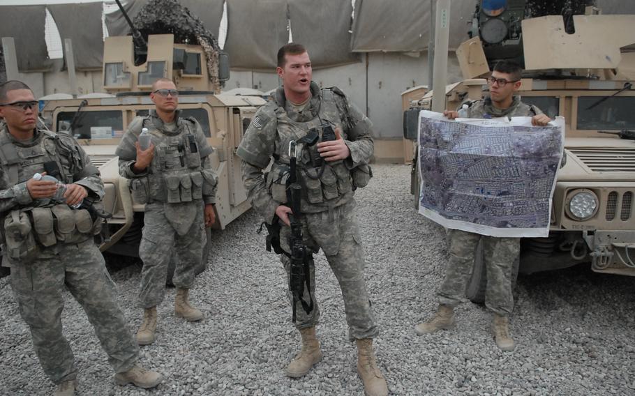 2nd Lt. Jedidiah Wentz, a platoon leader with Troop A, 1st Battalion, 75th Cavalry Regiment, gives a briefing prior to a patrol in the Gazaliyah district of western Baghdad. The troop took over a larger section of the district several months ago after other units in the battalion pushed into Shiite areas to the north.