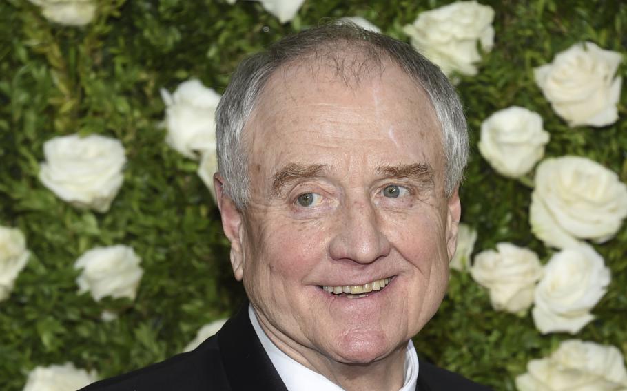 Actor Denis Arndt smiles at an award ceremony.