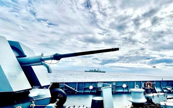 A photo taken from the deck of a Philippine naval ship, with Australian and Canadian navy vessels in the background.