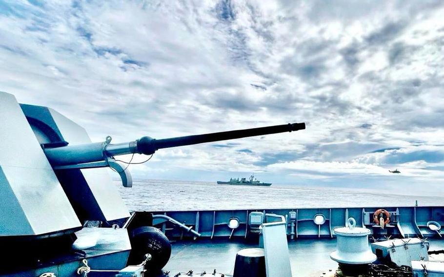 A photo taken from the deck of a Philippine naval ship, with Australian and Canadian navy vessels in the background.