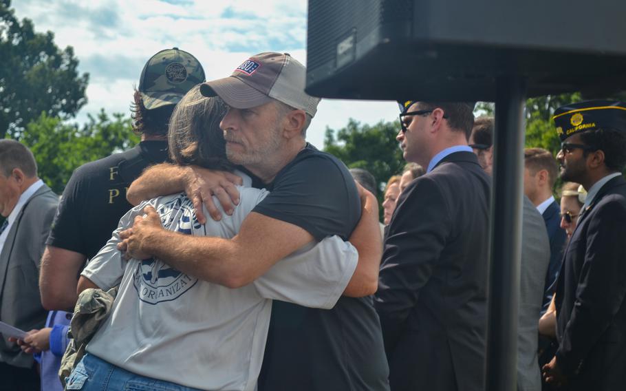 Comedian Jon Stewart hugs Susan Zeier on Thursday, July 28, 2022, during a rally on Capitol Hill in Washington, D.C., for the Sergeant First Class Heath Robinson Honoring Our Promise to Address Comprehensive Toxics Act of 2022, or PACT Act. Zeier is Robinson’s mother-in-law and helped care for him after he was diagnosed with a rare autoimmune disorder and lung cancer after serving with the Army National Guard in Kosovo and Iraq, where he experienced prolonged exposure to burn pits. Robinson died in 2020.