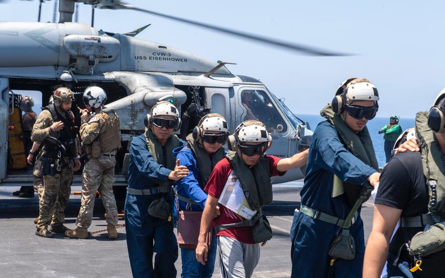 Sailors from the Dwight D. Eisenhower Carrier Strike Group render assistance to distressed mariners at sea in the Red Sea on Saturday, June 15, 2024. 