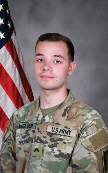 A soldier poses for an official photo.