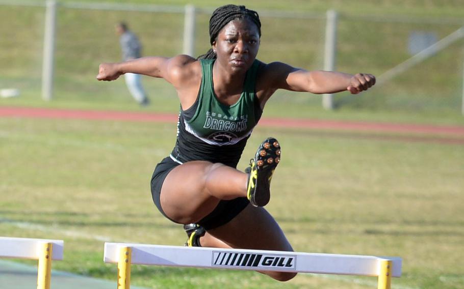 Kubasaki's Kenya Jones navigates the next to last hurdle in the 100-meter hurdles during Thursday's Day 2 of the two-day Okinawa track and field meet. Jones won in 18.00 seconds.