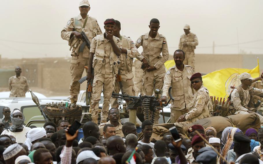 Sudanese soldiers from the Rapid Support Forces unit stand on their vehicle during a military-backed rally, in Mayo district, south of Khartoum, Sudan, Saturday, June 29, 2019. At least 32 people, including a U.N. peacekeeper, were killed Sunday, Nov. 19, 2023, following heavy fighting in the disputed Abyei administrative region, an area claimed by both Sudan and South Sudan, authorities said.