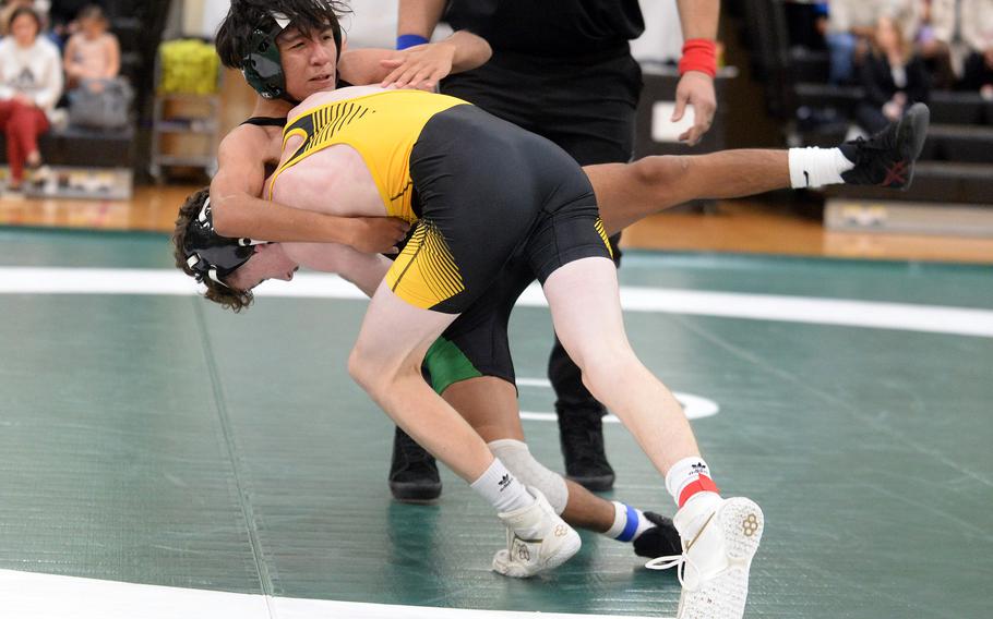 Kadena's Brayden Holmes throws Kubasaki's Jesse Fuentes to the mat at 108 pounds during Wednesday's Okinawa wrestling dual meet. Holmes won by technical fall 12-1 in 2 minutes, 30 seconds and the Panthers won the meet 30-27.