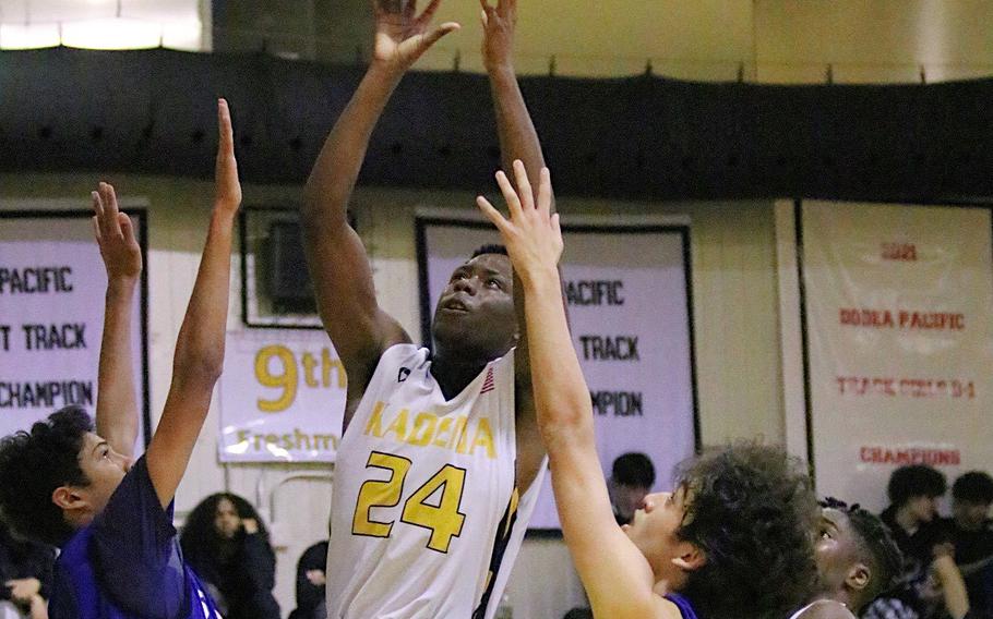 Kadena's Javontay Vickers goes up to shoot between St. Mary's defendiners in the boys D-I final.