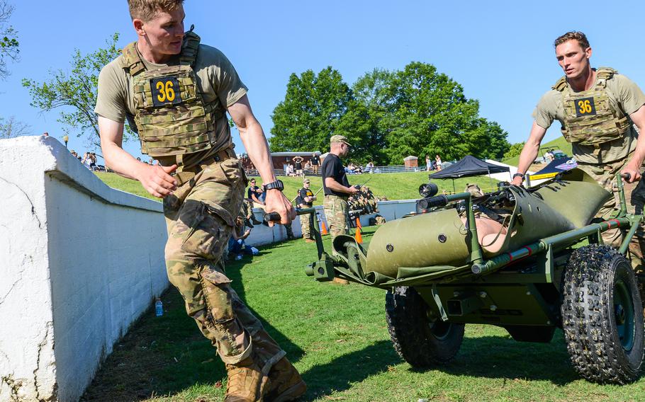 Army Spc. Justin Rein, left, and Capt. Luke Ebeling evacuate a casualty dummy during the second day of the Best Ranger Competition, Saturday, April 15, 2023 at Columbus, Ga.’s A.J. McClung Memorial Stadium. Rein and Ebeling, from the 75th Ranger Regiment, went on to win the 39th annual competition. (Corey Dickstein/Stars and Stripes)