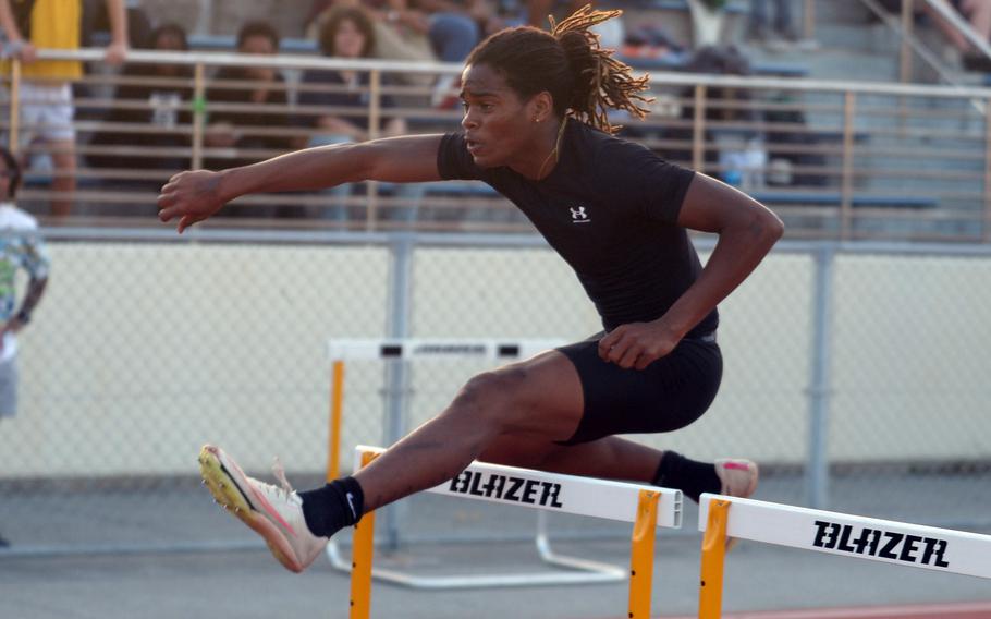 Carlos Cadet clears a hurdle.