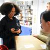 Senior Airman Erianna Weston scans a package for a service member at the Northside Post Office on Ramstein Air Base, Germany, on Monday, Dec. 5, 2022. Service members and their families stationed overseas are seeing an unusually high number of parcels from the United States returned to sender, adding more stress and uncertainty to ordering gifts for the holidays.