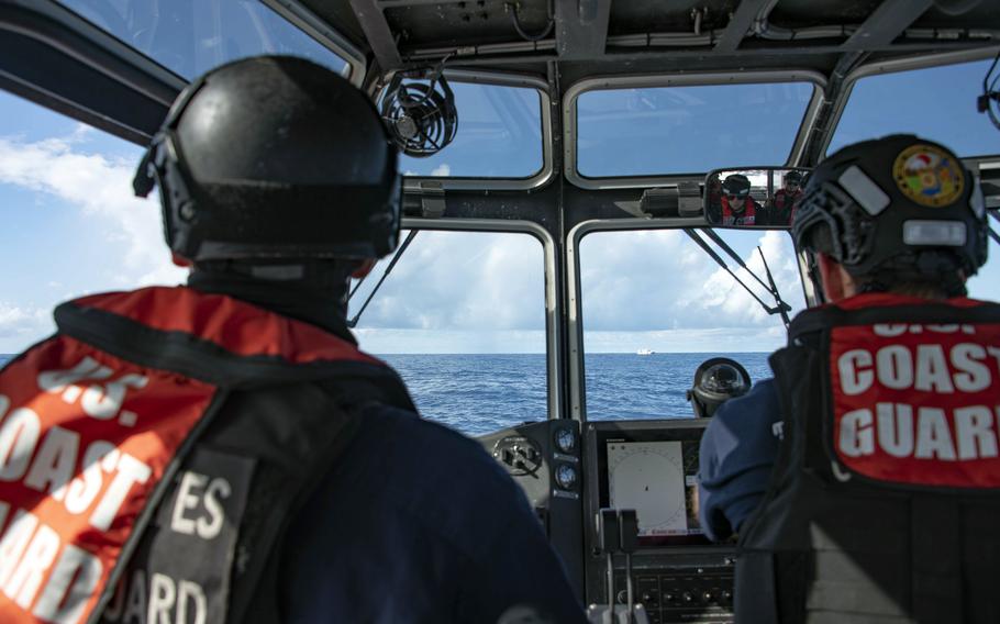 Crew members assigned to the U.S. Coast Guard cutter Stratton drive an interceptor boat toward a Taiwanese fishing vessel in the Pacific Ocean, Feb. 2, 2022. 