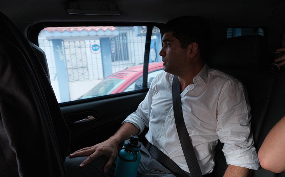 Candidate Otto Sonnenholzner, who was accompanied by his security team, heads home from a meeting in Guayaquil, Ecuador, on Tuesday. 