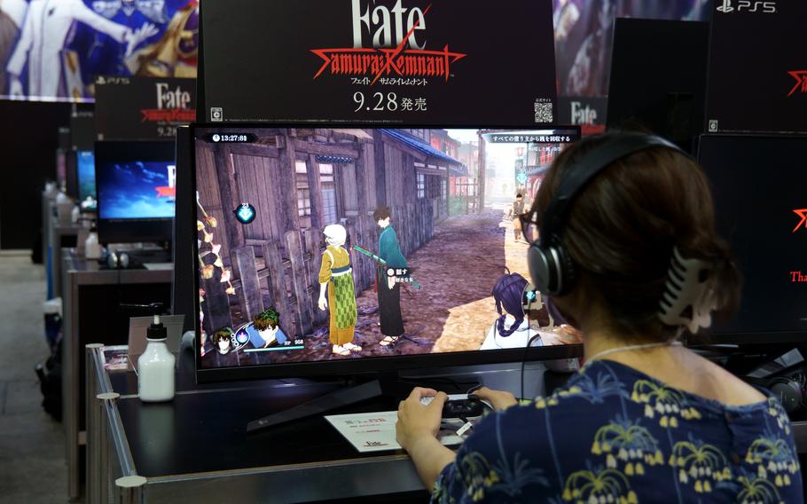 Visitors trial-play KOEI's Fate Samurai Remnant at The Tokyo Game Show in Chiba, Japan, on Sept. 21, 2023.