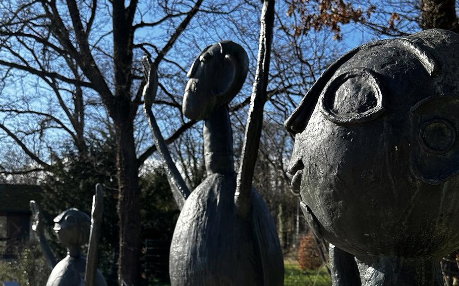 These three figures come together to form the “Picture of Hope,” found at the top of the sculpture garden in Erlangen, Germany. All of the figures are seen overlooking the city.