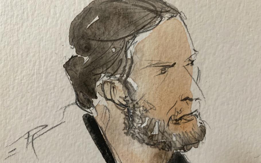 A courtroom sketch shows key defendant Salah Abdeslam, in the special courtroom built for the 2015 attacks trial, in Paris, on Sept. 8, 2021.