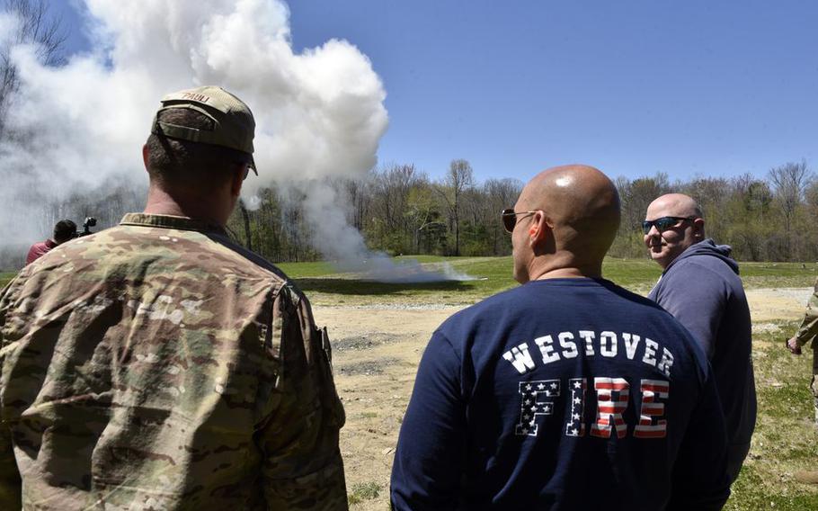 Attendees watch an accelerant burn during Joint FBI and Westover Post Blast Investigation Training held at Westover Air Reserve Base in Chicopee, Mass. 