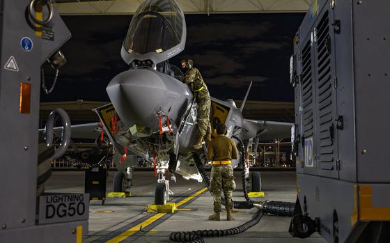 Airmen perform maintenance on an F-35 Lightning II fighter jet at Nellis Air Force Base, Nev., Feb. 2, 2021. The jet may fill a niche, rather than become the workhorse the Pentagon planned for, some analysts said. 