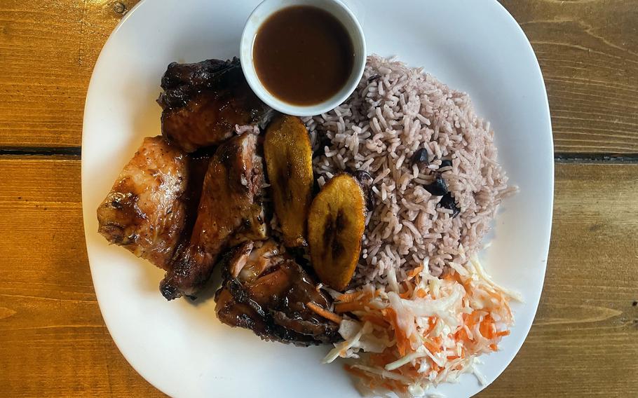 Bickles Jamaican Grill’s jerk chicken plate, served with peas and rice, coleslaw and plantains. 