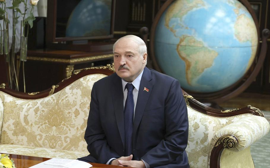 Belarusian President Alexander Lukashenko listens to World Health organization Director for Europe Hans Kluge during their meeting in Minsk, Belarus, Thursday, Oct. 14, 2021. 