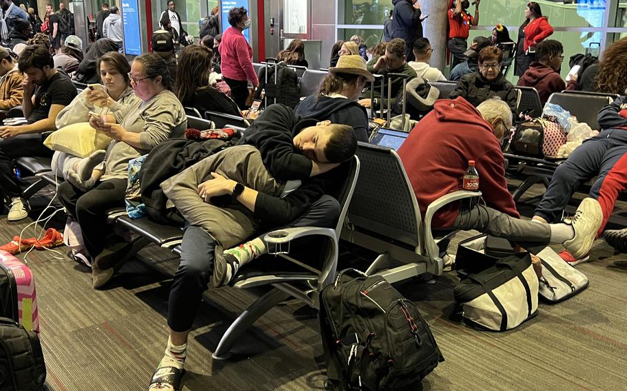 Passengers wait to board a Southwest flight to Reagan National Airport at Dallas Love Field. The flight was canceled when it was short one flight attendant after being delayed for more than six hours.