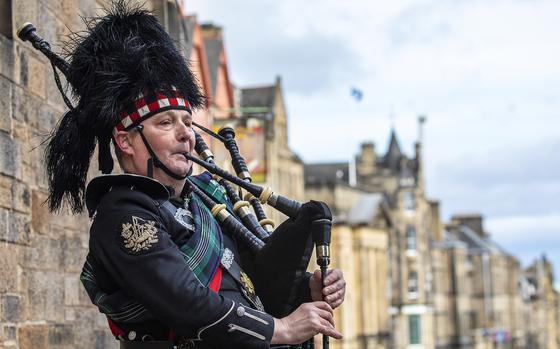 A bagpiper in traditional uniform performs in Edinburgh, Scotland. August is a wonderful time to hear traditional Scottish instruments such as bagpipes at various events in Scotland such as The Royal Edinburgh Military Tattoo, through Aug. 23, and Glasgow’s International Piping Festival, running Aug. 11-17.