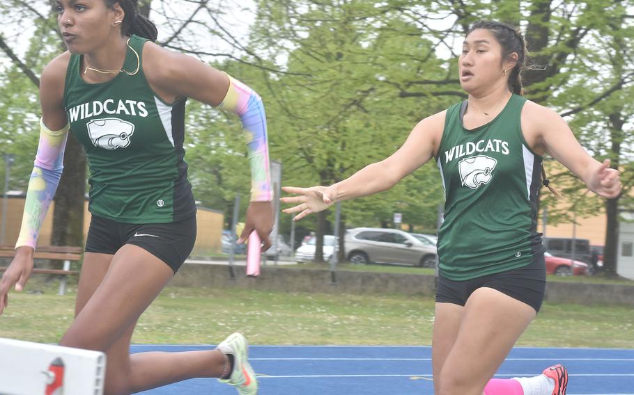 Naples' anchor runner Abigail Michienzi takes the baton from Aleigh Lamis on the way to a Wildcats victory in the 400-meter relay event Saturday, April 23, 2022, in Pordenone, Italy. 