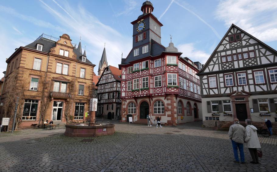The Marktplatz with its old half-timbered houses in Heppenheim, Germany. In the background, the steeples of St. Peter’s church peek over the rooftops.