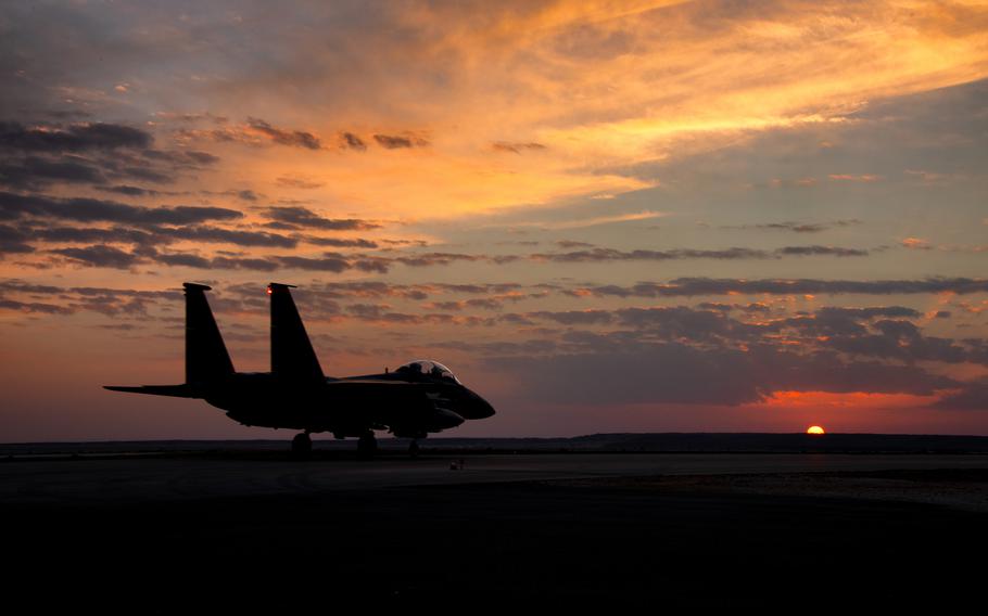 An F-15E Strike Eagle, deployed to the 332d Air Expeditionary Wing, prepares for takeoff just as the sun sets at in undisclosed location in Southwest Asia. 