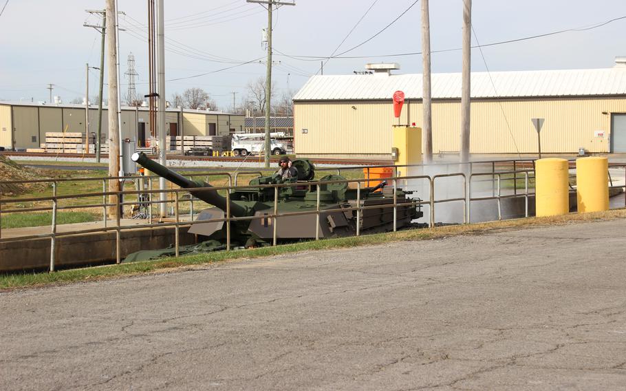 An M1 Abrams is tested in a water fording pit at Joint Systems Manufacturing Center-Lima to ensure that it can operate in austere environments. A Change of Command ceremony was held at the U.S. Army Joint Systems Manufacturing Center-Lima bringing in a civilian, Travis D. Adkins to replace Lt. Col. George P. Kloppenburg.