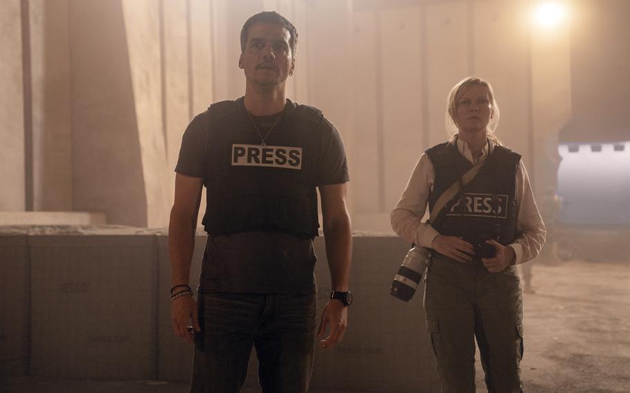 “Civil War” highlights the central role reporters, like the ones played by Wagner Moura, left, and Kirsten Dunst, right, have in capturing critical events in lethal conditions.  
