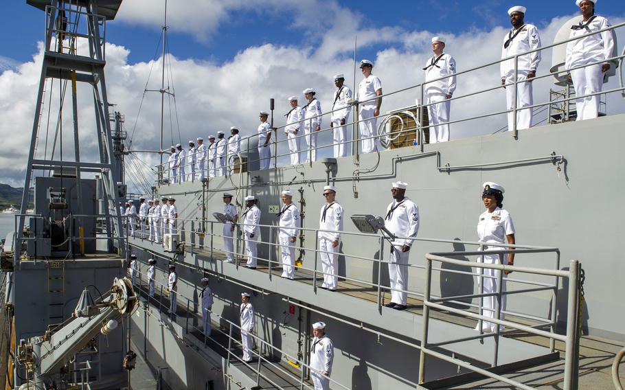 Sailors assigned to USS Frank Cable man the rails as the submarine tender returns to its homeport in Apra Harbor, Guam, Oct. 6, 2023.