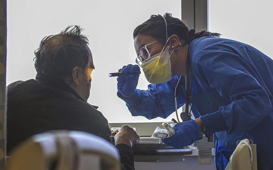 A nurse attends to a non-COVID patient at a hospital in West Covina, Calif., on Feb. 8, 2022.