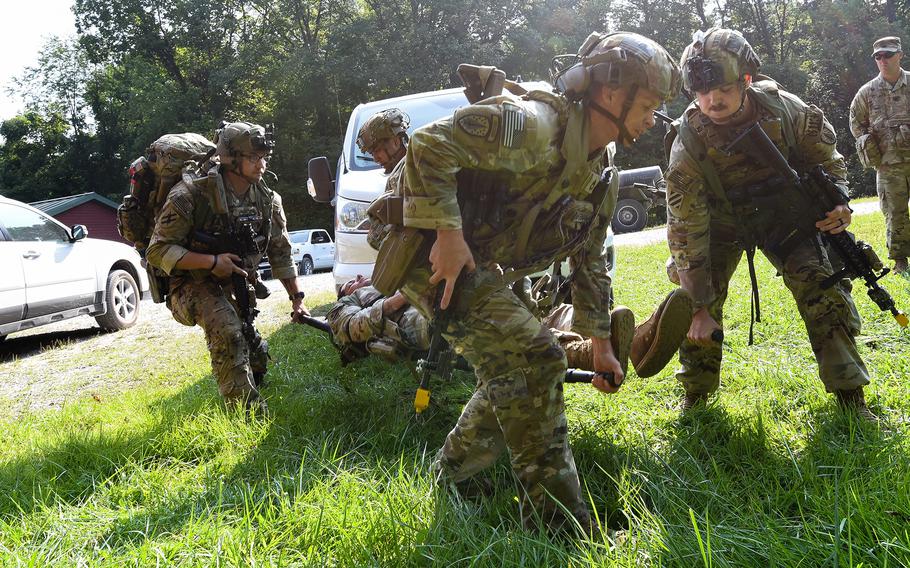 Security Force Assistance Brigade soldiers — known as advisors — help a soldier with a simulated injury during a pre-deployment training exercise on Aug. 23, 2023, at Muscatatuck Training Center in Indiana.