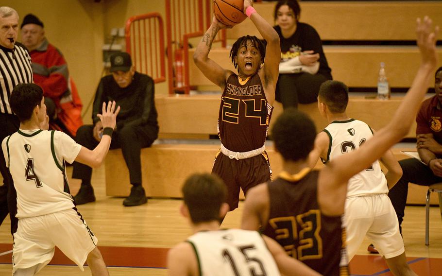 Baumholder’s Jon Kimuli looks to pass as his team plays keep away during the second half of a DODEA-Europe Division III basketball semifinal game Feb. 17, 2023, in Baumholder, Germany.