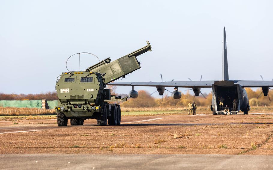 A High Mobility Artillery Rocket System leaves a U.S. aircraft during an exercise in Riga, Latvia, Oct. 25, 2021. U.S. Army Europe and Africa deployed soldiers and two HIMARS systems to Latvia on Sept. 26, 2022, to demonstrate rapid artillery deployment to NATO’s eastern flank.