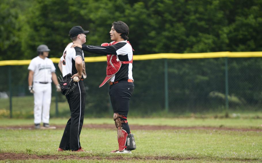Spangdahlem catcher Casey Supinger encourages pitcher Mason Dearing during a rough stretch during a 14-0 loss to Naples during a 2024 DODEA European baseball championship game against Spangdahlem on May 22, 2024, at Southside Fitness Center on Ramstein Air Base, Germany.