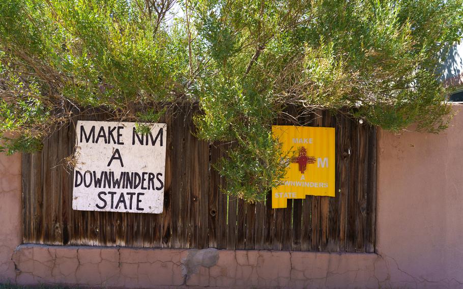 Signs calling for New Mexicans to be included in the federal Radiation Exposure Compensation Act are posted around Tularosa’s downtown on July 25, 2023. 