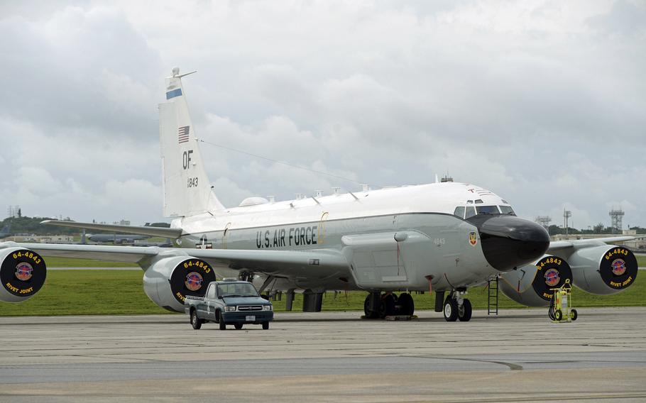 An Air Force RC-135V/W Rivet Joint reconnaissance aircraft sits near the flight line at Kadena Air Base, Okinawa, Friday, April 21, 2023.