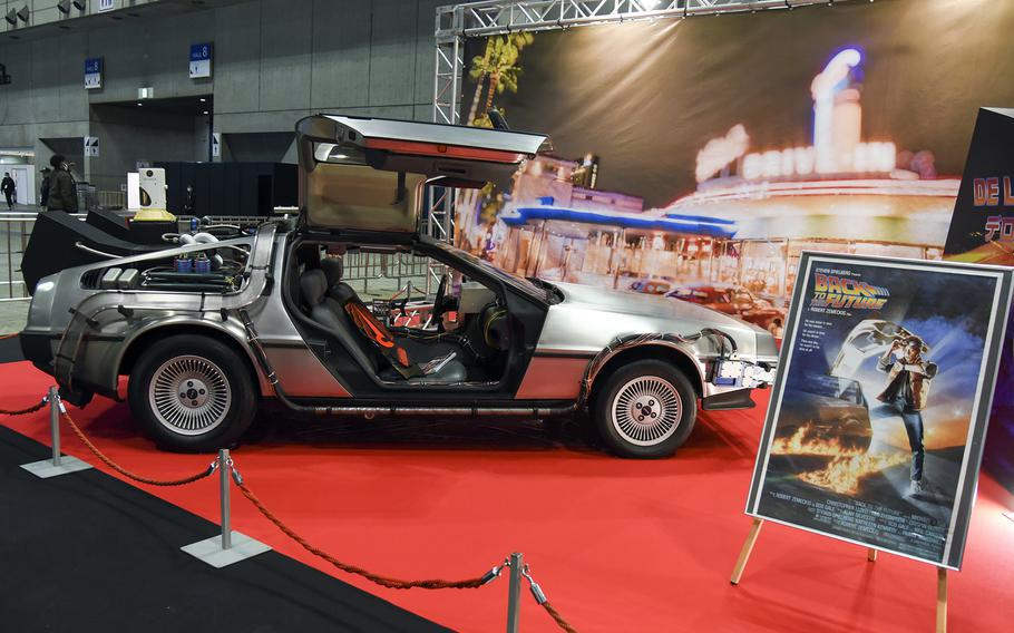 A car redesigned to look like the DeLorean time machine from “Back to the Future” is displayed.