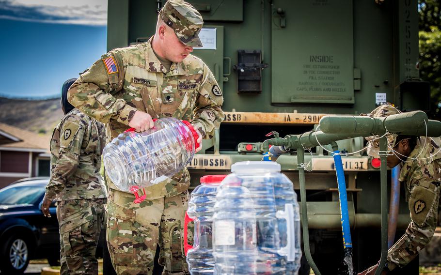 Soldiers with the 25th Infantry Division distributed water on Dec. 2, 2021, at Aliamanu Military Reservation, Hawaii. Soldiers were providing support to local residents after jet fuel from the Navy’s Red Hill Underground Fuel Storage Facility spilled into the nearby water supply.