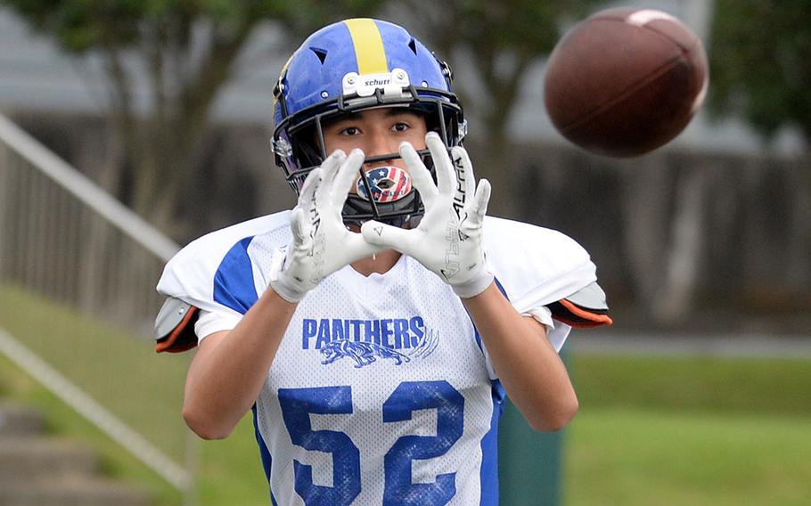 Yokota sophomore Alex Sparks snags a practice pass.