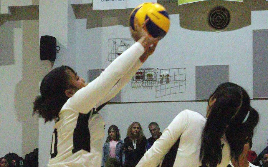 Humphreys' Kimora Peoples passes the ball in front of teammate Evelyn Kim during Wednesday's Korea girls volleyball match. Yongsan International School of Seoul beat the Blackhawks in four sets.