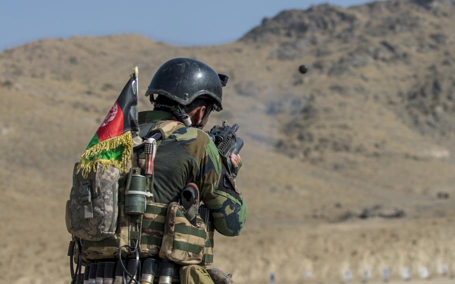 An Afghan commando fires his M203 grenade launcher during advanced skills training at Camp Commando, Kabul in 2017. Afghan special operations forces will continue to be trained by the U.S.-led NATO alliance, but will probably train  in Europe, said Gen. Tod Wolters, head of U.S. European command.