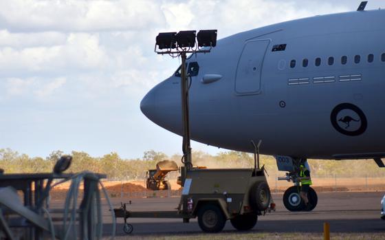 A Royal Australian Air Force plane passes a worksite on RAAF Tindal, Australia, Sept. 1, 2022. The space is being expanded to accommodate aircraft as large as U.S. Air Force B-52 bombers.