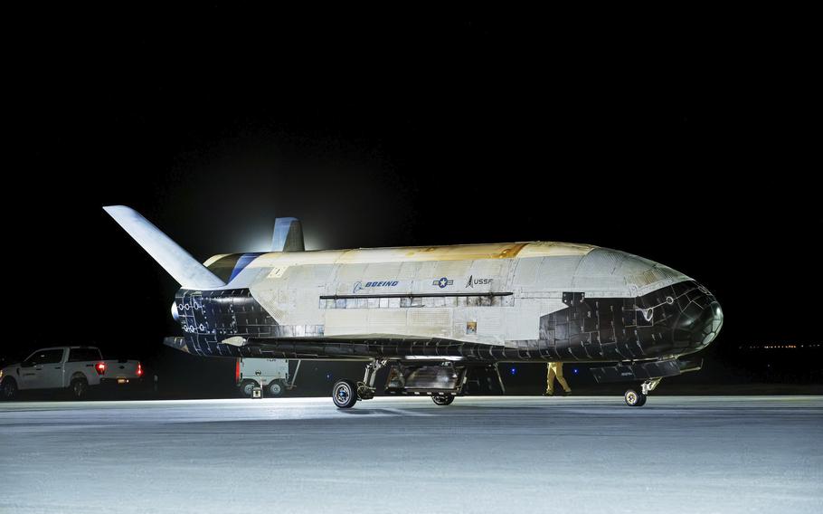A space plane lands at a Space Force base.
