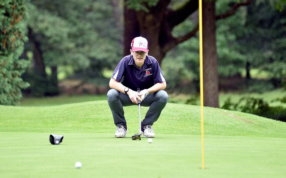 Lakenheath's Ethan Wright sizes up his putt on Woodlawn Golf Course's No. 1 hole during the first day of the DODEA European golf championships on Oct. 12, 2023, on Ramstein Air Base, Germany.