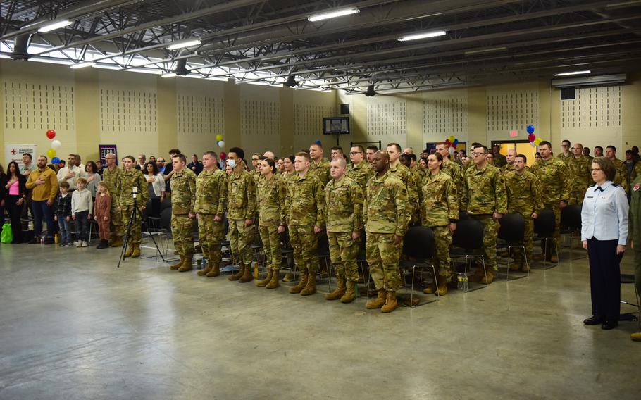 Airmen assigned to the Ohio Air National Guard’s 178th Wing stand at attention, along with family and friends, during a Call to Duty ceremony March 6, 2022 in Springfield, Ohio. The airmen are scheduled to deploy to support U.S. Central Command operations. 