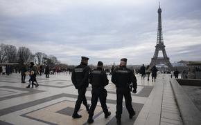 French gendarmes patrol the Trocadero plaza near the Eiffel Tower after a man targeted passersbys late saturday, killing a German tourist with a knife and injuring two others in Paris, Sunday, Dec. 3, 2023. Police subdued the man, a 25-year-old French citizen who had spent four years in prison for a violent offense. After his arrest, he expressed anguish about Muslims dying, notably in the Palestinian territories. (AP Photo/Christophe Ena)